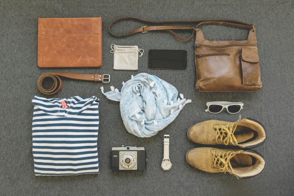 pexels photo 322207 322207 Vintage travel essentials flat lay with leather bags, shoes, camera, and clothing.